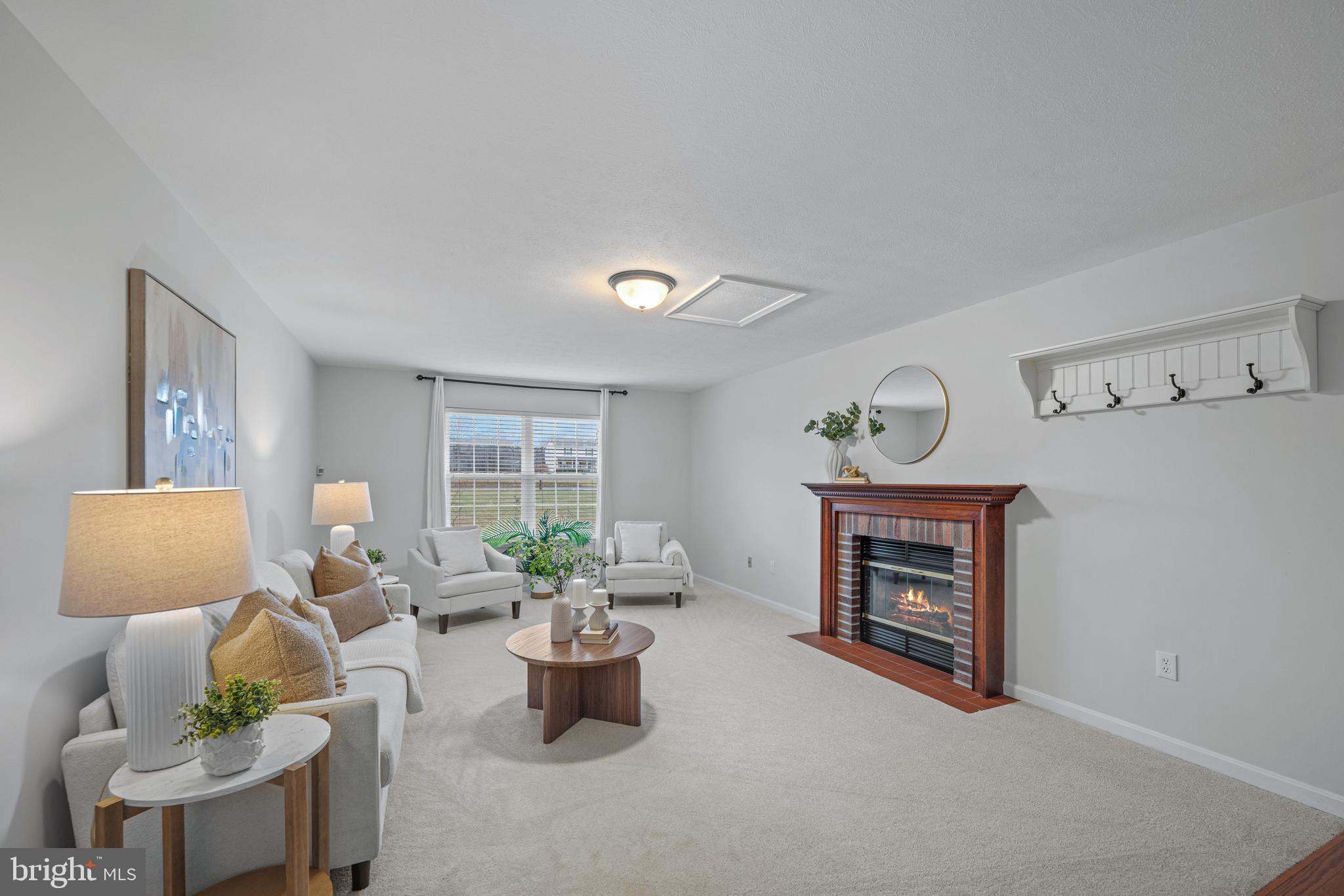 3211 Hayloft Court Woodbine, MD 21797 - Photo 17 of 69 a living room with furniture a window and a fireplace