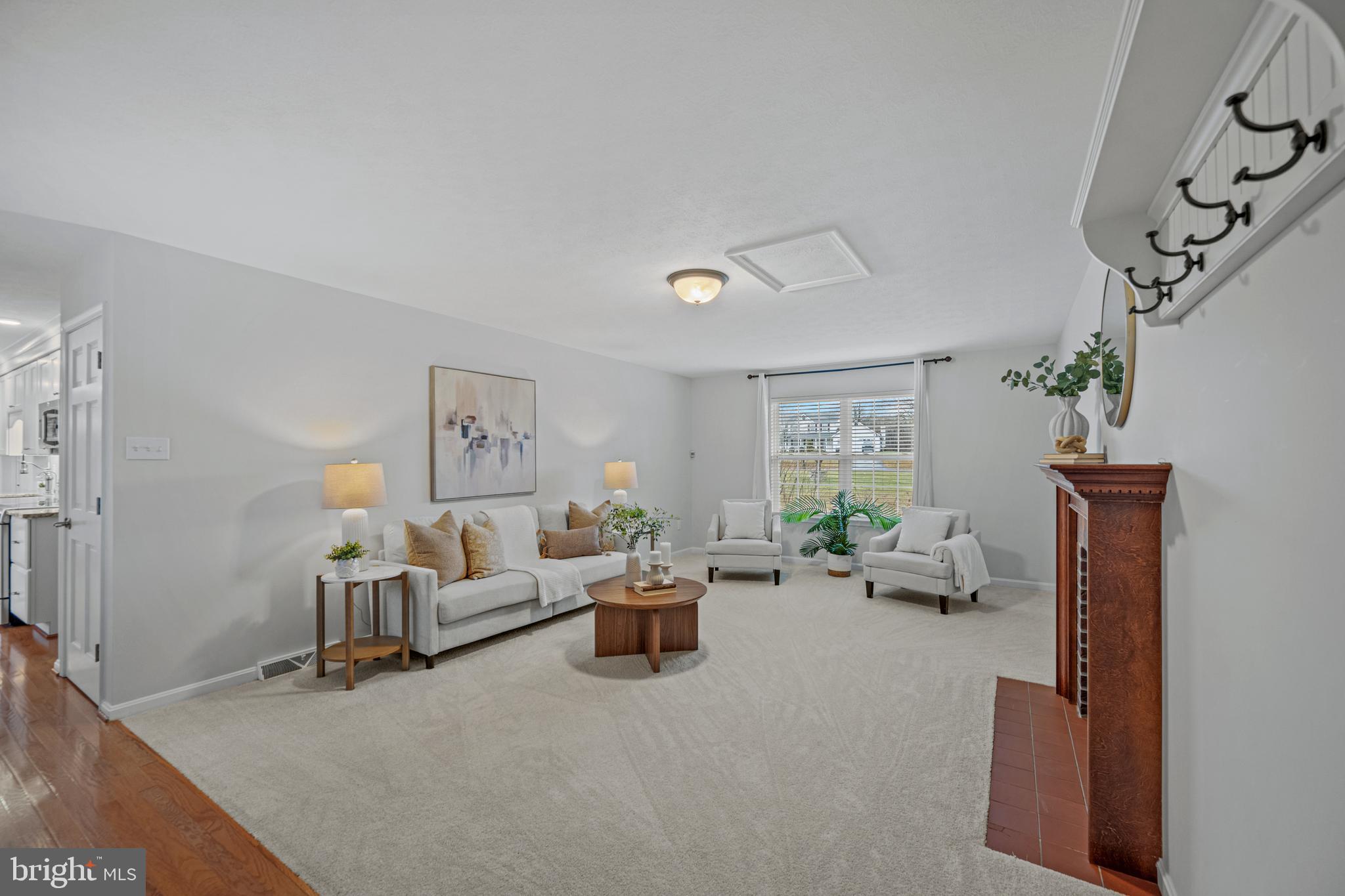 3211 Hayloft Court Woodbine, MD 21797 - Photo 18 of 69 a living room with furniture stairs and a window