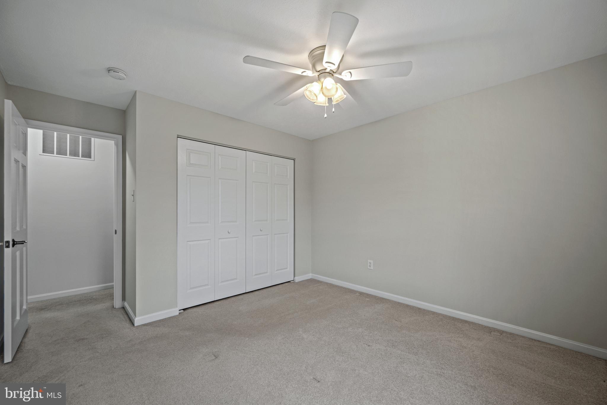 3211 Hayloft Court Woodbine, MD 21797 - Photo 22 of 69 an empty room with a chandelier fan and windows