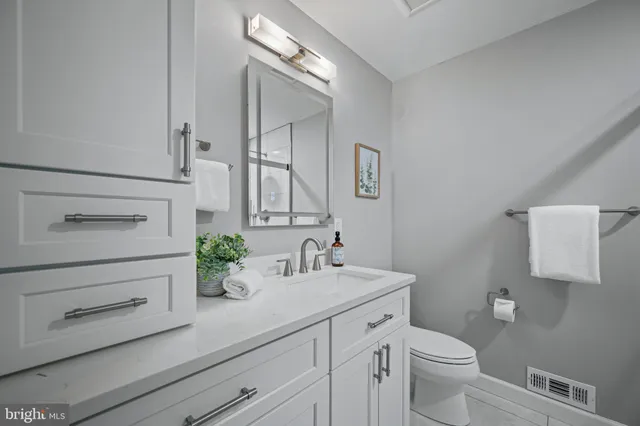 a bedroom with a bed window and a flat screen tv