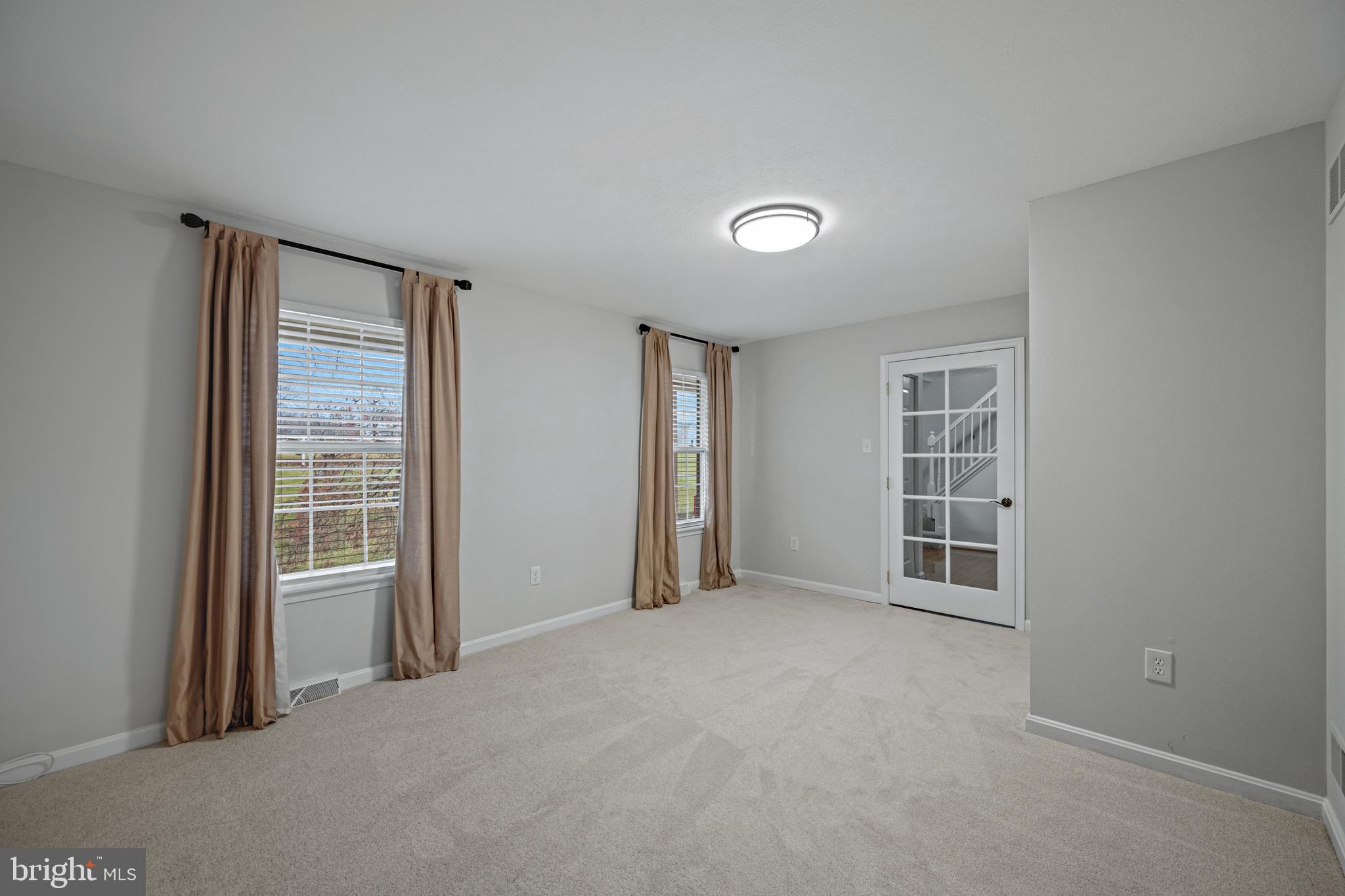 3211 Hayloft Court Woodbine, MD 21797 - Photo 3 of 69 an empty room with windows
