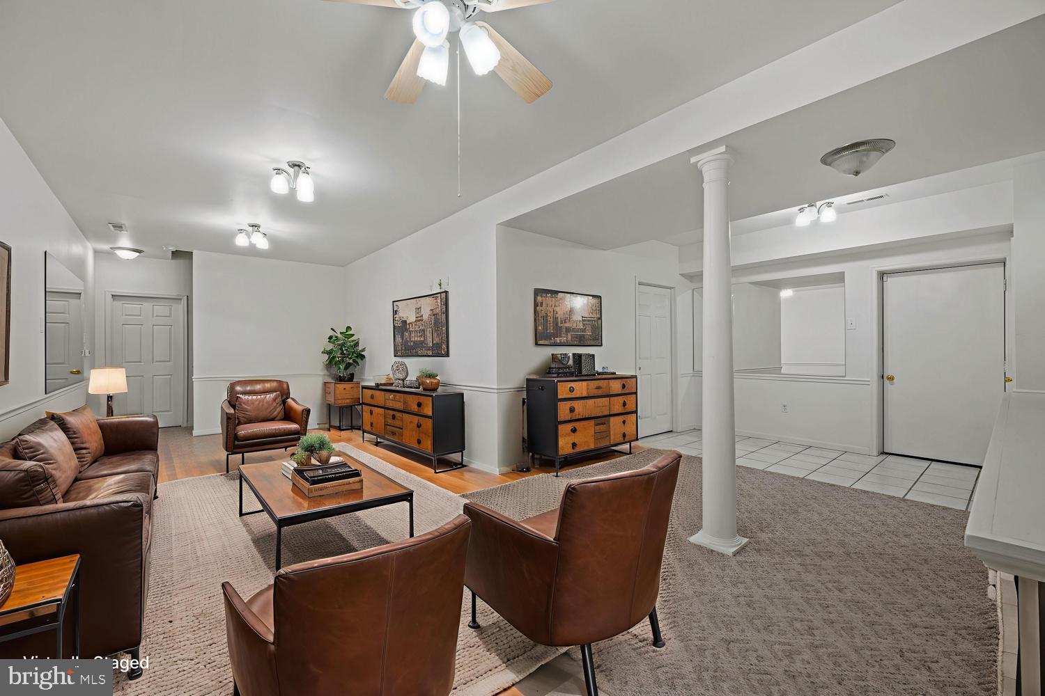 3211 Hayloft Court Woodbine, MD 21797 - Photo 35 of 69 a living room with furniture a flat screen tv and a chandelier
