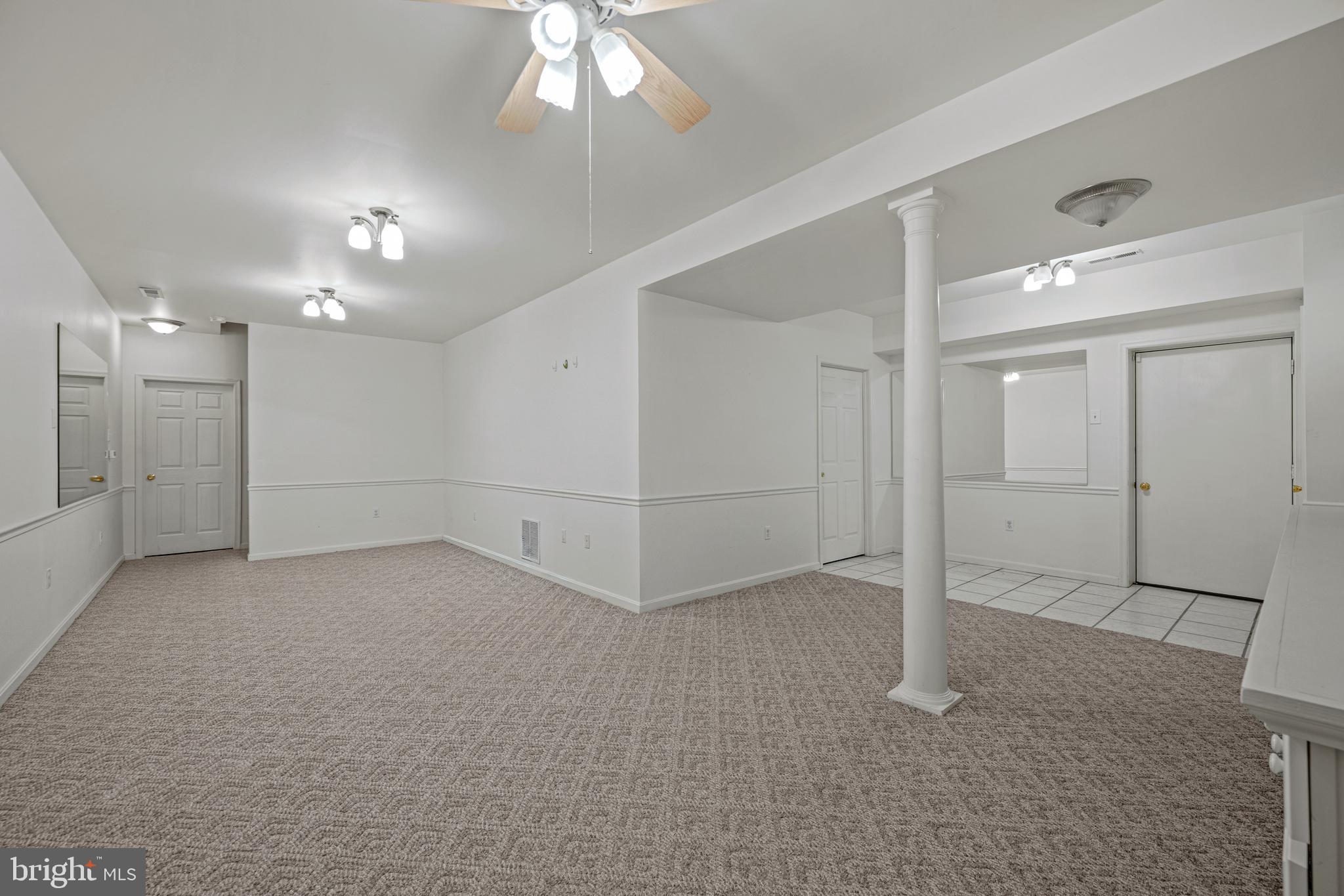 3211 Hayloft Court Woodbine, MD 21797 - Photo 36 of 69 en empty room with white walls and chandelier fan