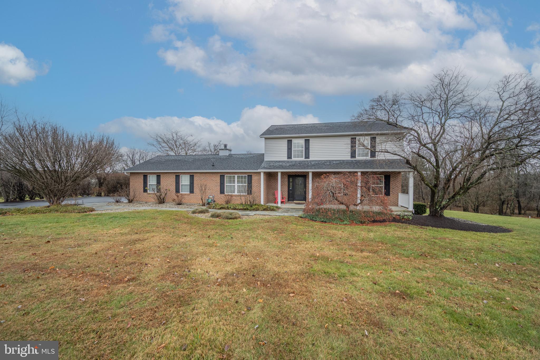 3211 Hayloft Court Woodbine, MD 21797 - Photo 38 of 69 a view of a yard in front of a house with a garden