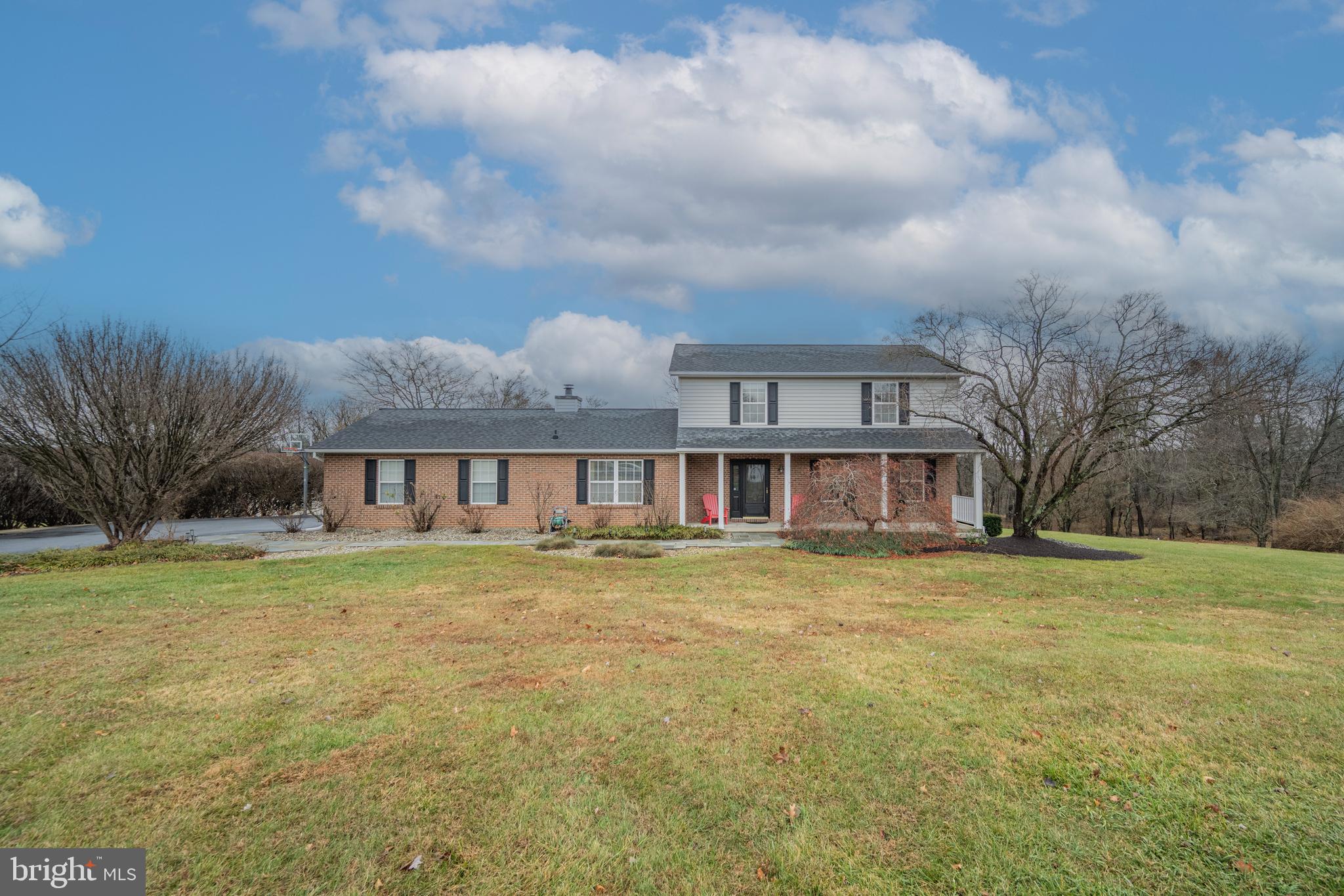 3211 Hayloft Court Woodbine, MD 21797 - Photo 40 of 69 a front view of a house with a garden