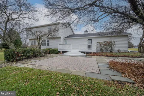 an aerial view of a house with a swimming pool