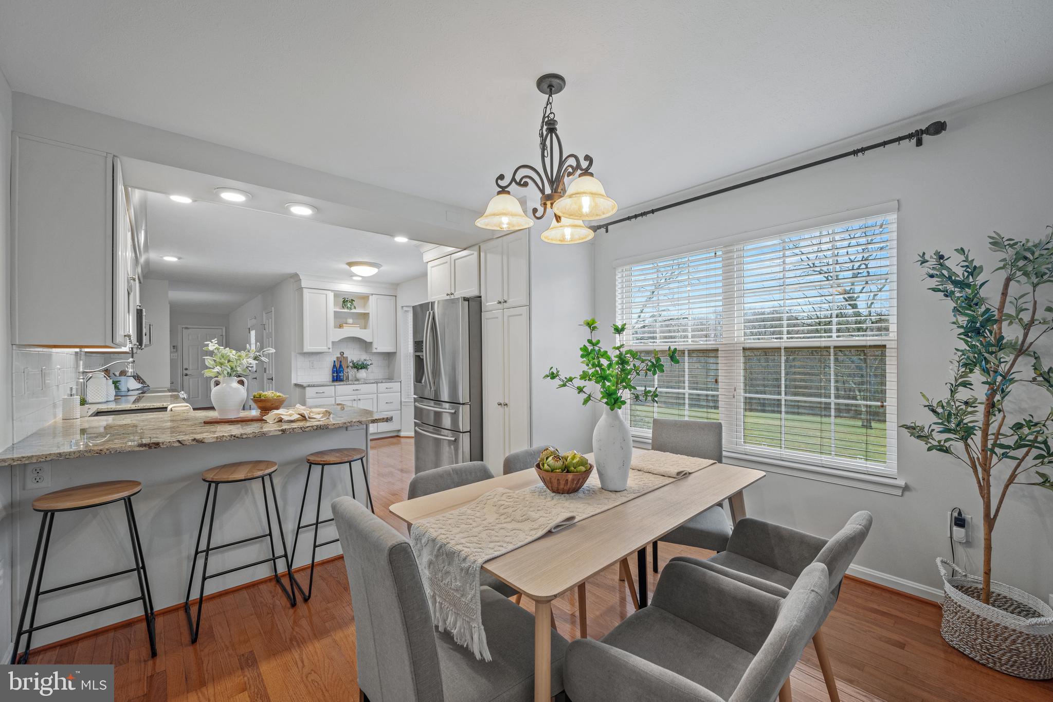 3211 Hayloft Court Woodbine, MD 21797 - Photo 5 of 69 a view of a dining room with furniture window and wooden floor