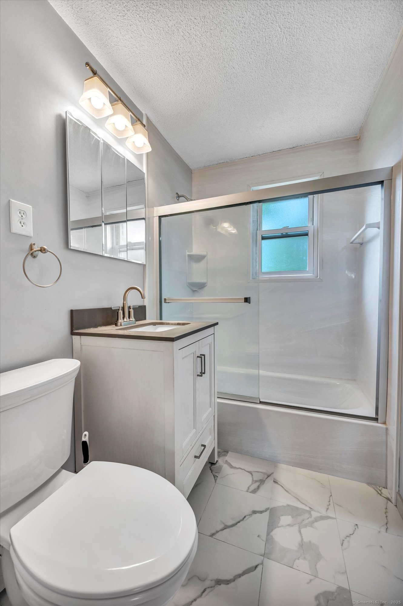 26 Colonial Drive, Unit C Rocky Hill, CT 06067 - Photo 11 of 14 a white toilet sitting next to a bathroom sink