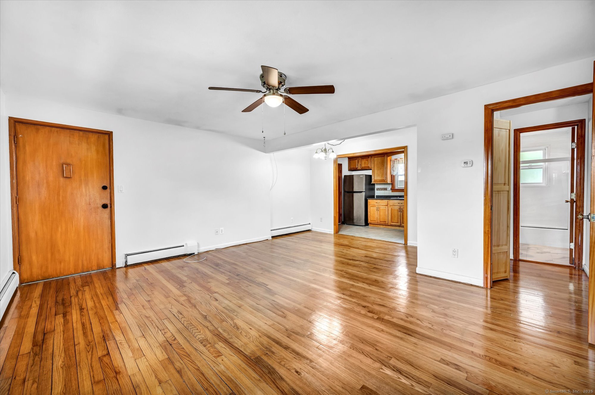 26 Colonial Drive, Unit C Rocky Hill, CT 06067 - Photo 13 of 14 a view of empty room with wooden floor and fan