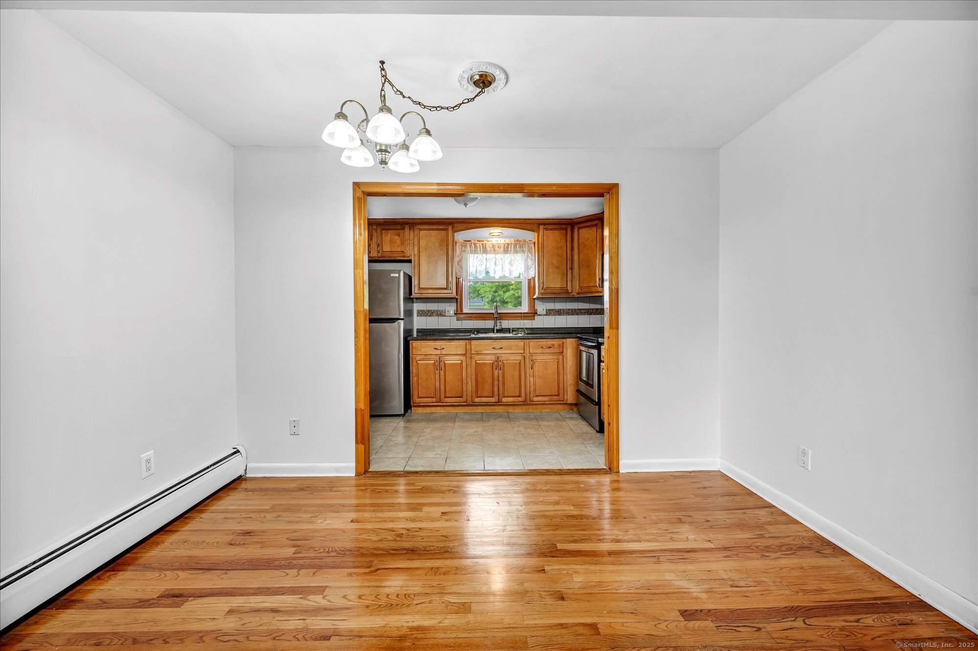 26 Colonial Drive, Unit C Rocky Hill, CT 06067 - Photo 6 of 14 a view of a room with wooden floor and window