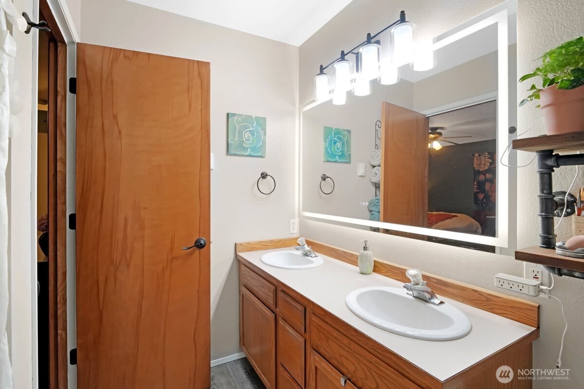 25 Clemons Road Montesano, WA 98563 - Photo 13 of 32 a bathroom with a sink vanity granite and a mirror