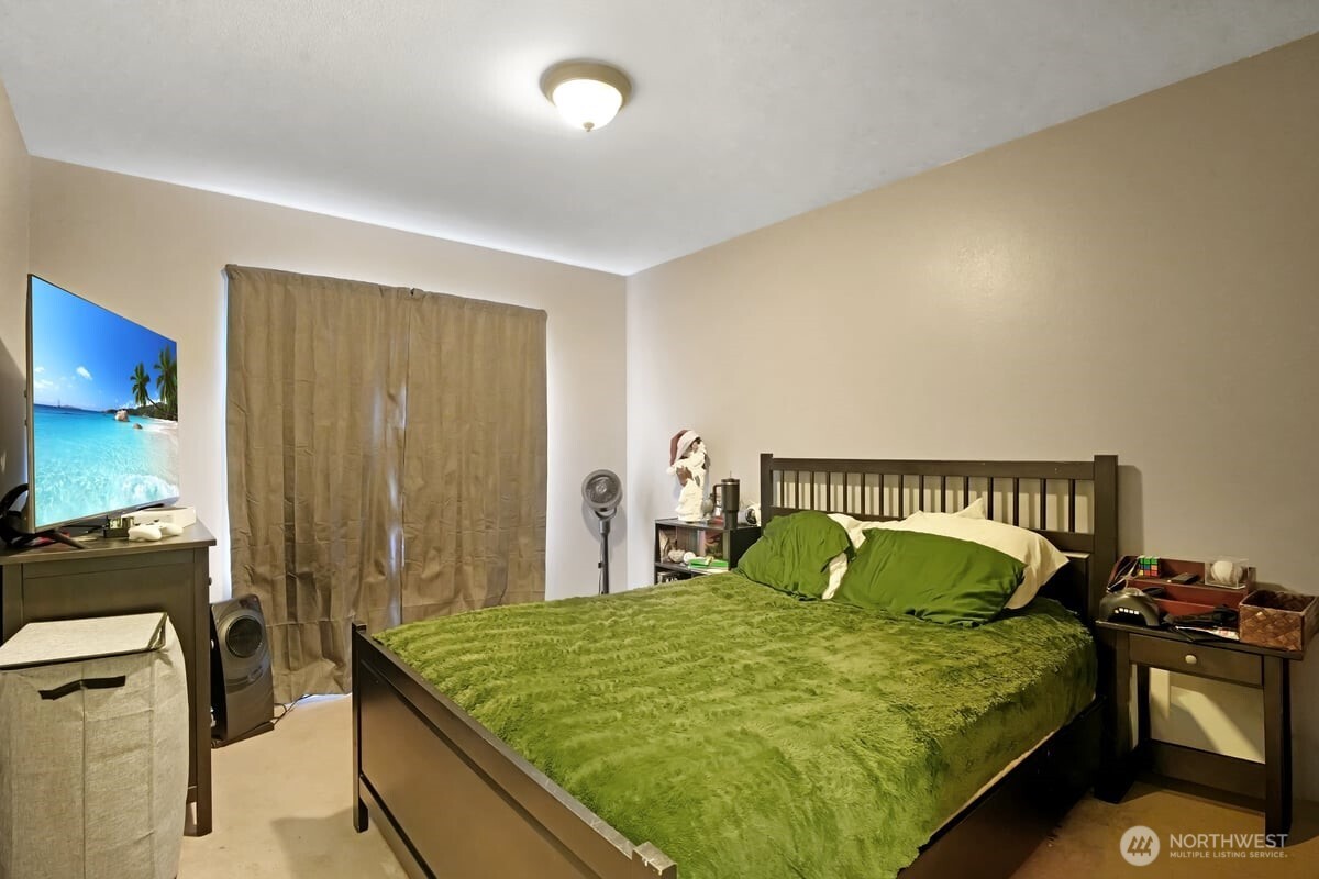 25 Clemons Road Montesano, WA 98563 - Photo 15 of 32 a bed sitting in a bedroom next to a window