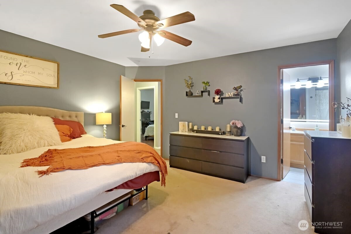 25 Clemons Road Montesano, WA 98563 - Photo 17 of 32 a bedroom with a bed and a chandelier