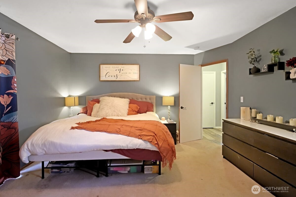 25 Clemons Road Montesano, WA 98563 - Photo 18 of 32 a bedroom with a bed and a chandelier