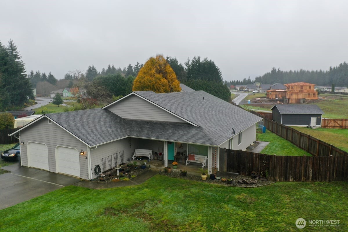 25 Clemons Road Montesano, WA 98563 - Photo 25 of 32 a aerial view of a house next to a big yard and large trees