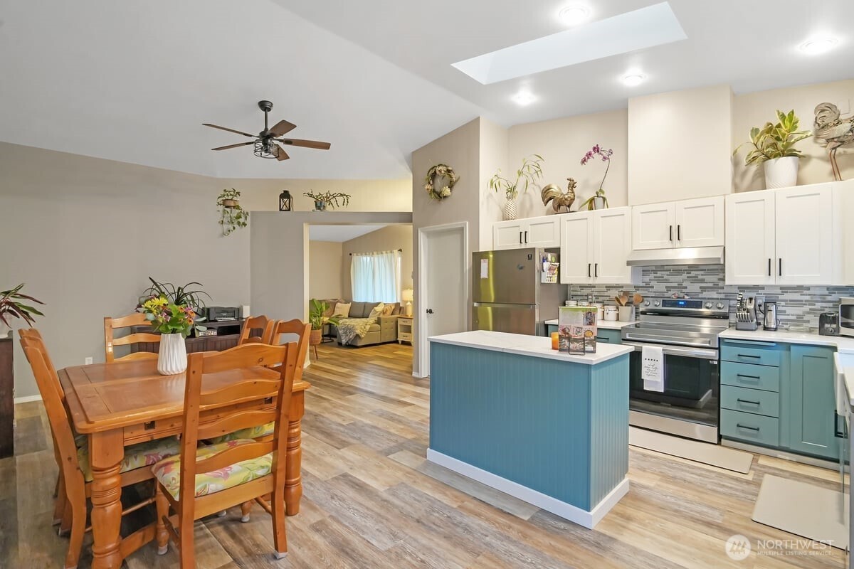 25 Clemons Road Montesano, WA 98563 - Photo 7 of 32 a view of a dining room with furniture and wooden floor