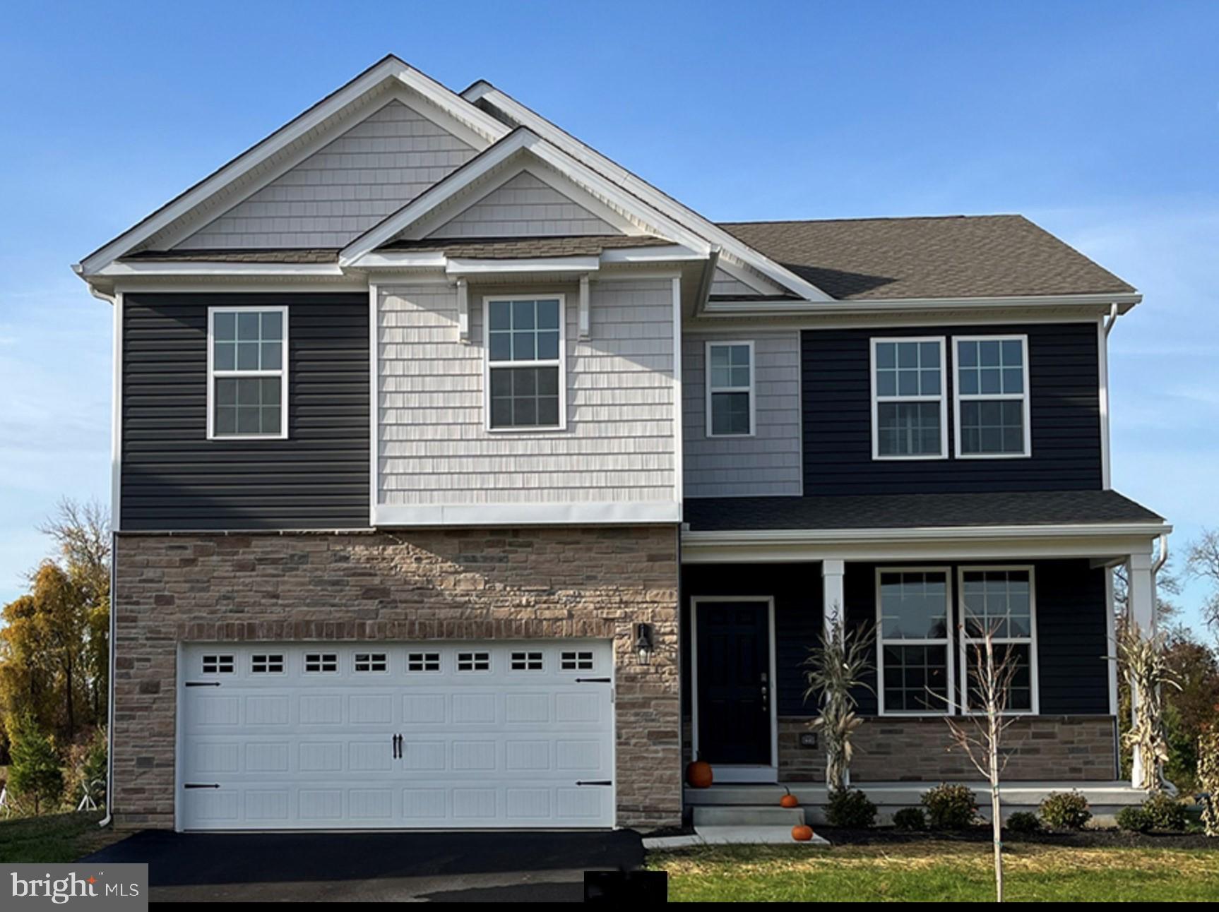 121 Winding Road Easton, PA 18040 - Photo 4 of 24 a front view of a house with a yard