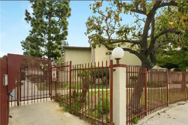 a view of a wrought iron fences in front of house