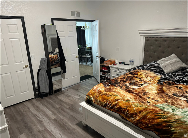 265 Mindella Way Layton, UT 84041 - Photo 23 of 32 Bedroom featuring wood-finish flooring and white paneled doors