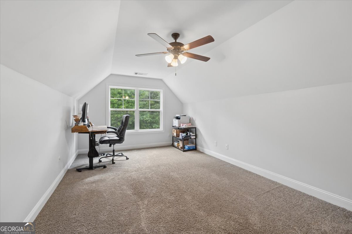 683 Teagle Road Forsyth, GA 31029 - Photo 28 of 50 a view of a livingroom with a ceiling fan and a window