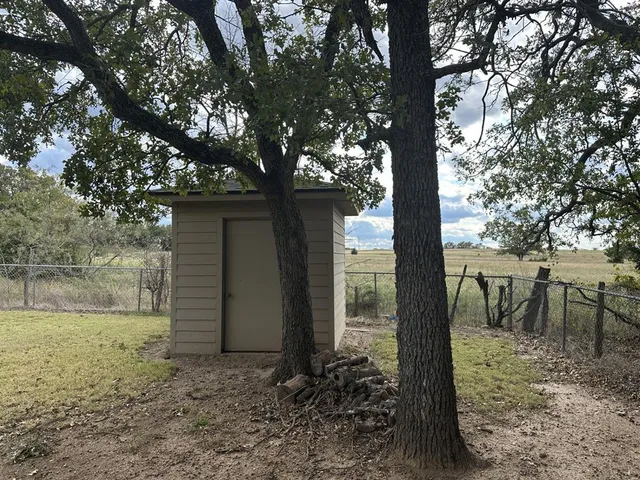 a view of backyard with trees