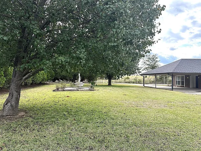 a view of a yard with an trees