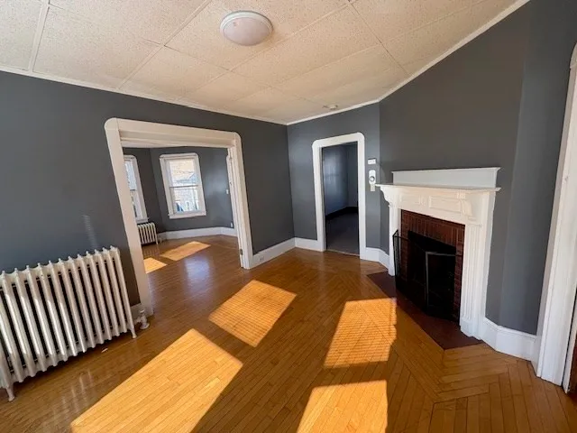 a bedroom with bed and a fireplace
