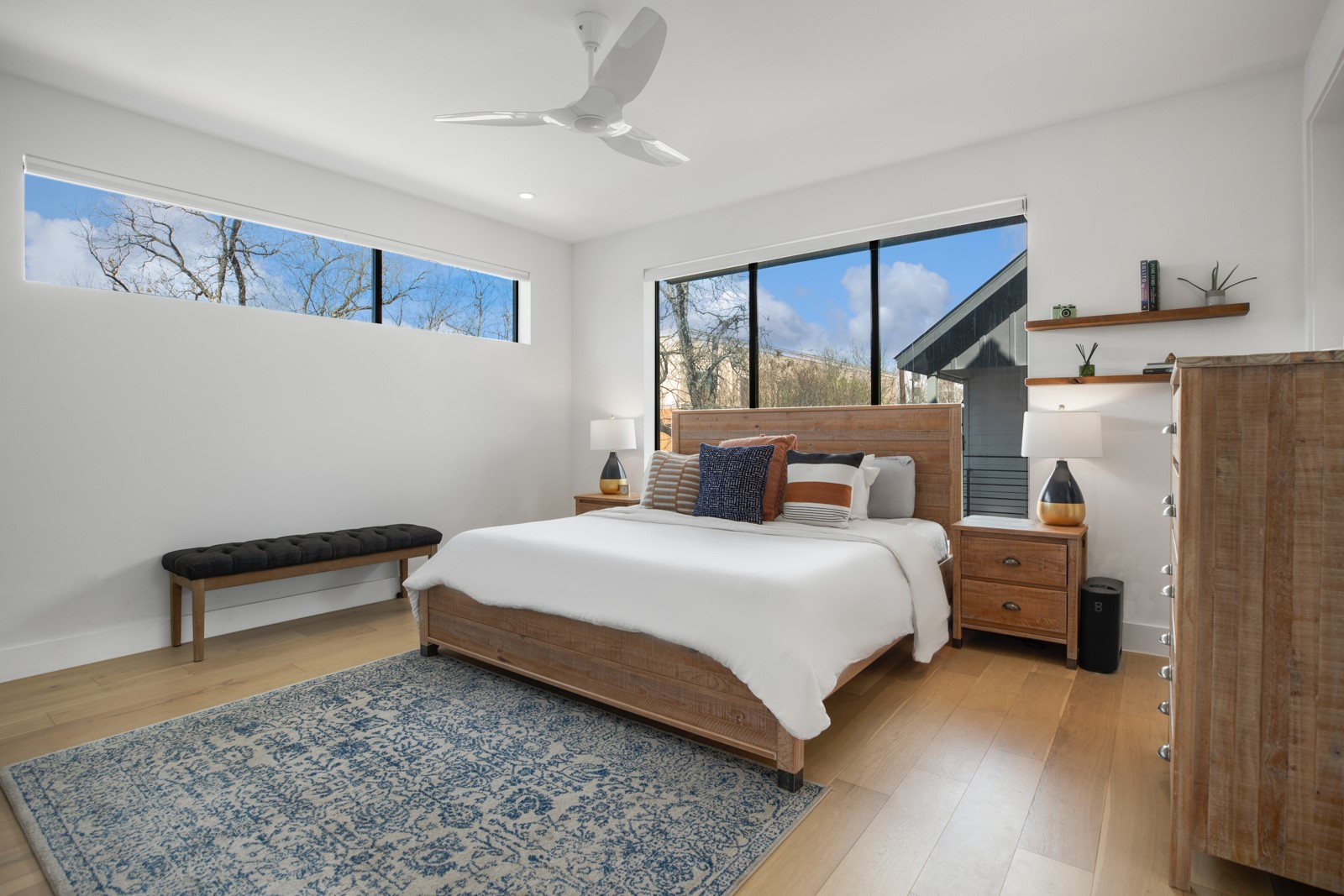 1410 East 3rd Street, Unit A Austin, TX 78702 - Photo 16 of 40 a bedroom with a bed and wooden floor