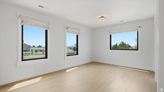 2038 East Ranch Road Eagle Mountain, UT 84005 - Photo 26 of 66 Bright room featuring light wood-finish flooring, white walls, and a recessed ceiling light