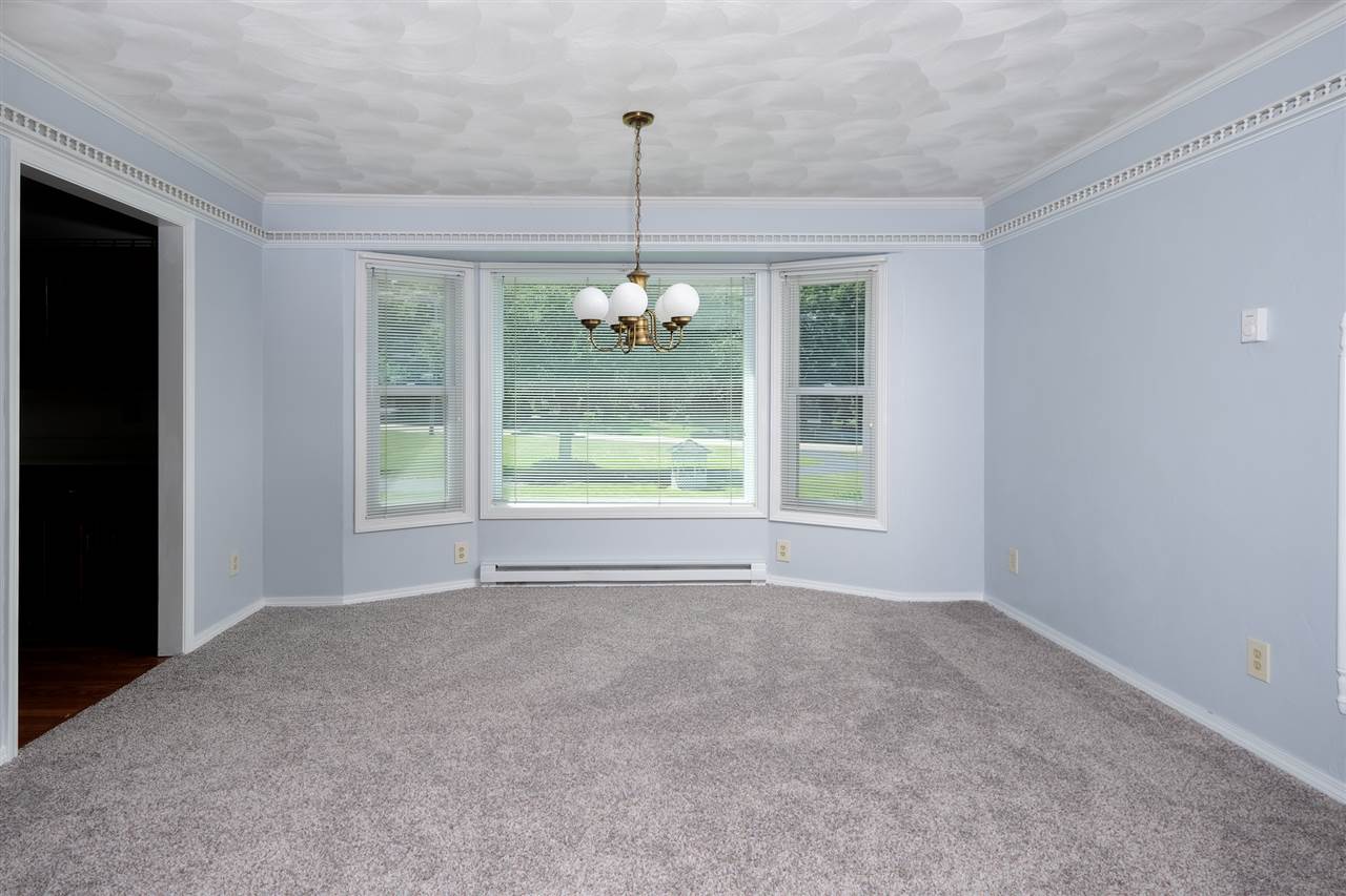 10097 Beaver Valley Road Belvidere, IL 61008 - Photo 8 of 22 a view of an empty room with windows and outdoor view