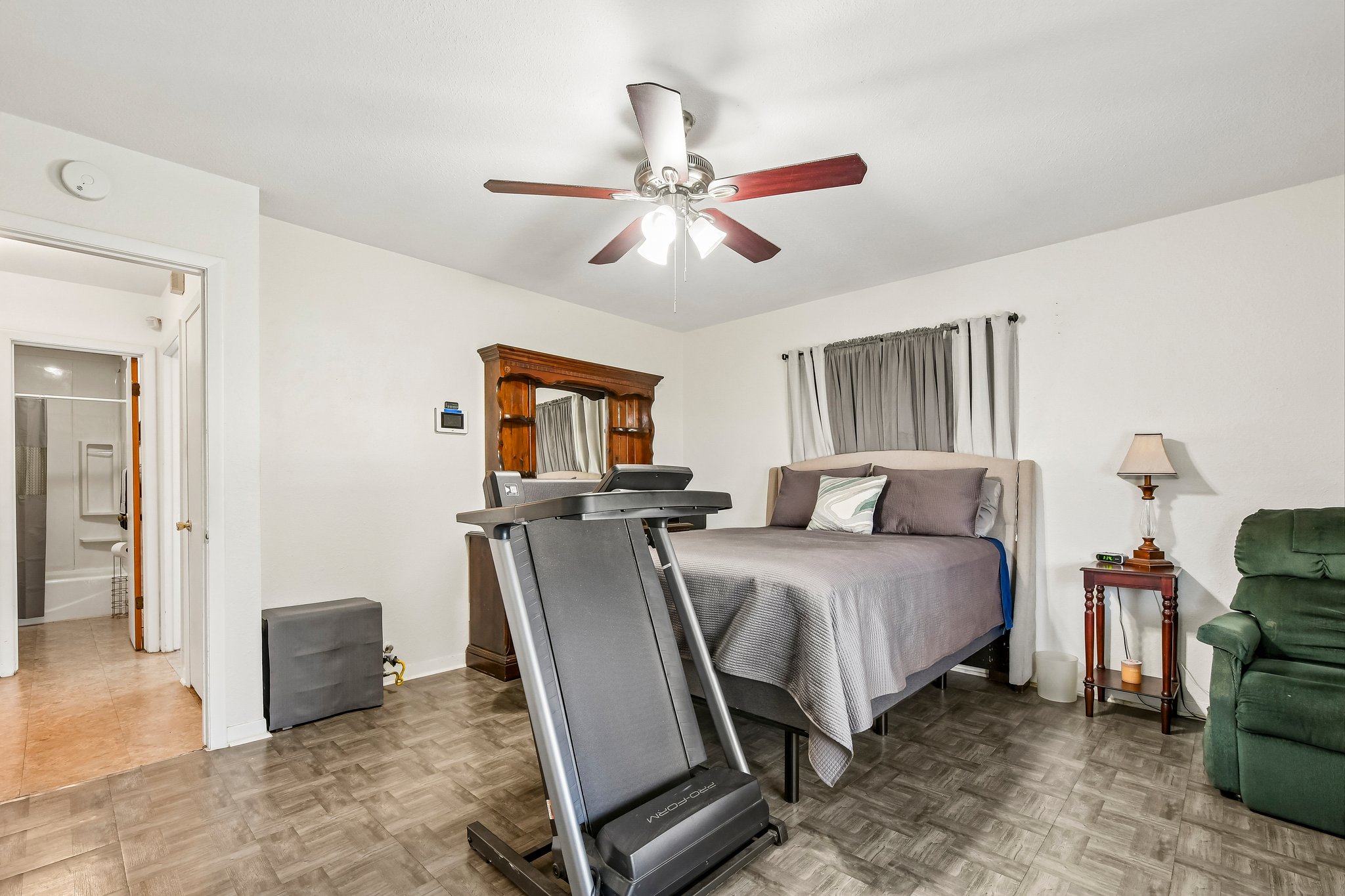 101 Brown Street Elgin, TX 78621 - Photo 18 of 32 a bed room with a bed and a chair