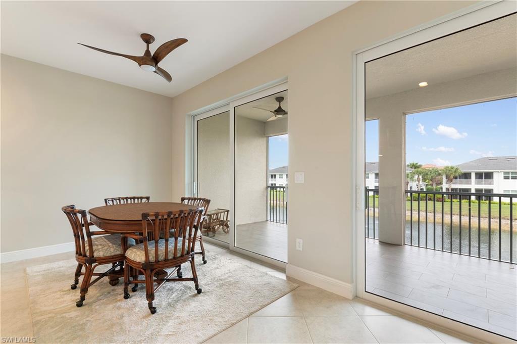 6954 Avalon Circle, Unit 706 Naples, FL 34112 - Photo 12 of 26 a view of a dining room with furniture