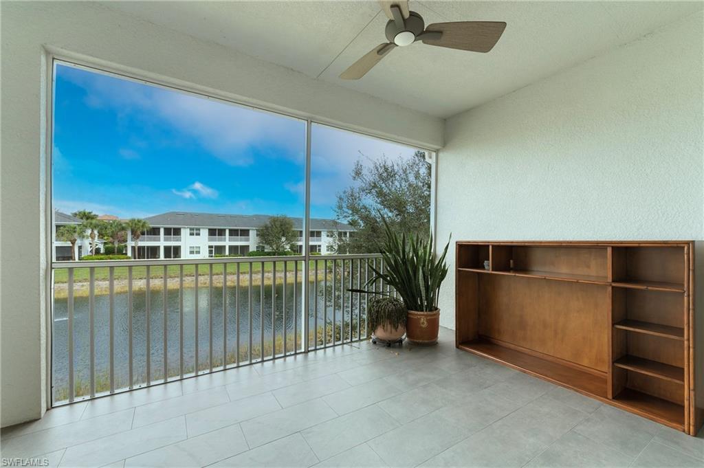 6954 Avalon Circle, Unit 706 Naples, FL 34112 - Photo 14 of 26 an empty room with windows and ceiling fan