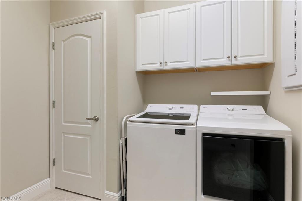 6954 Avalon Circle, Unit 706 Naples, FL 34112 - Photo 25 of 26 a utility room with dryer and washer