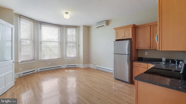 a view of a kitchen with a dishwasher and a refrigerator