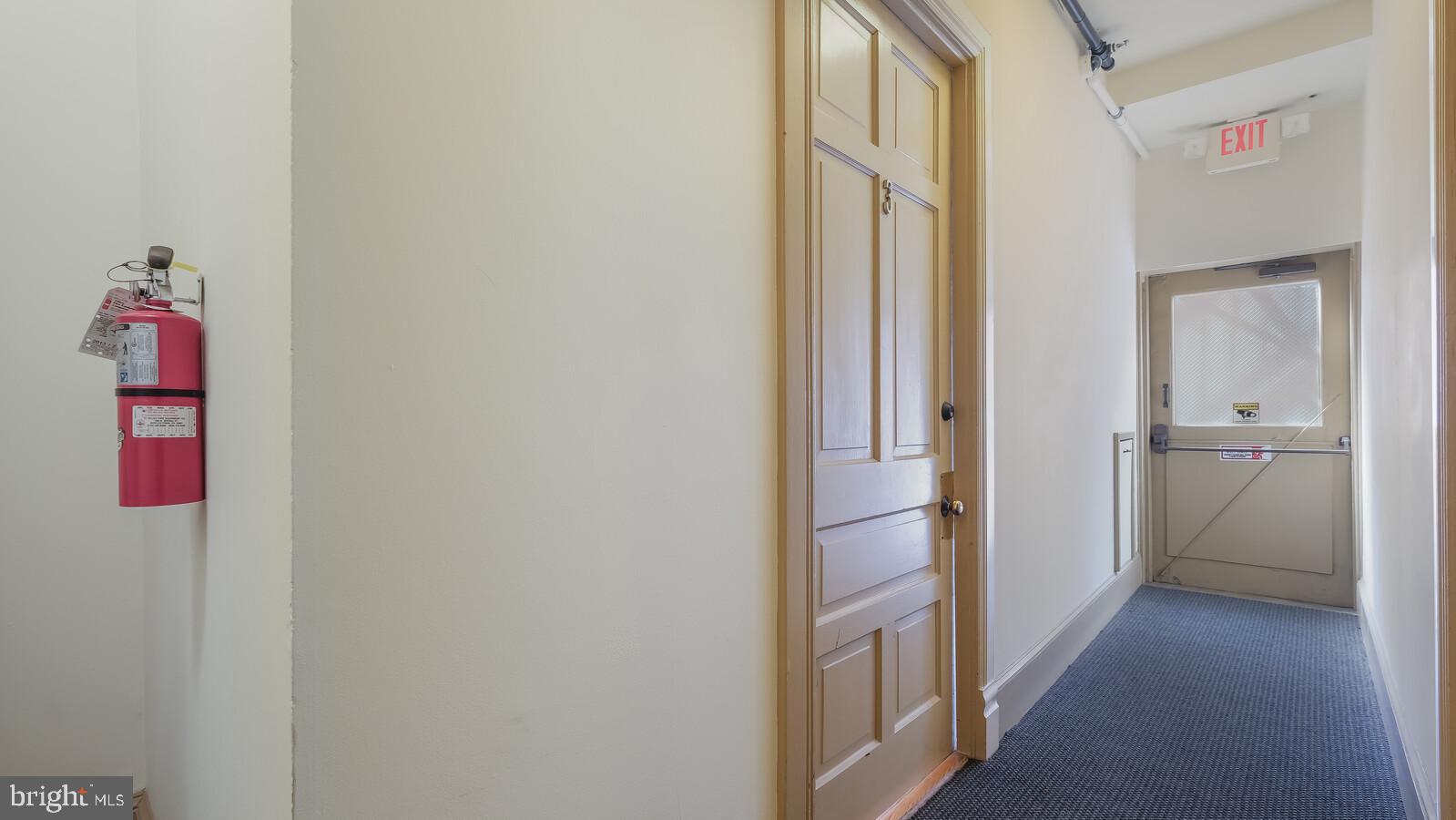 22 North Main Street, Unit 3 Doylestown, PA 18901 - Photo 6 of 18 a view of a hallway with wooden floor and closet