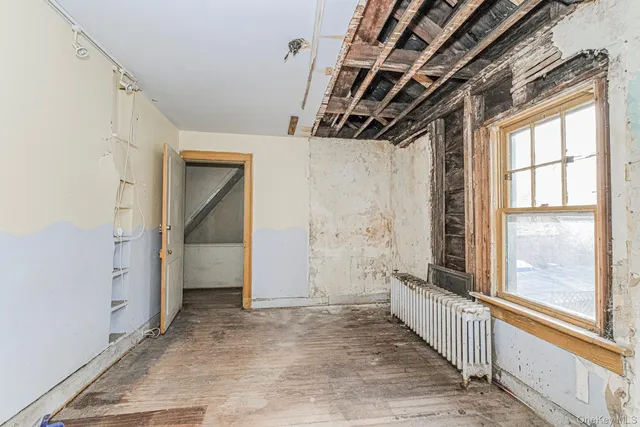 a view of an empty room with windows