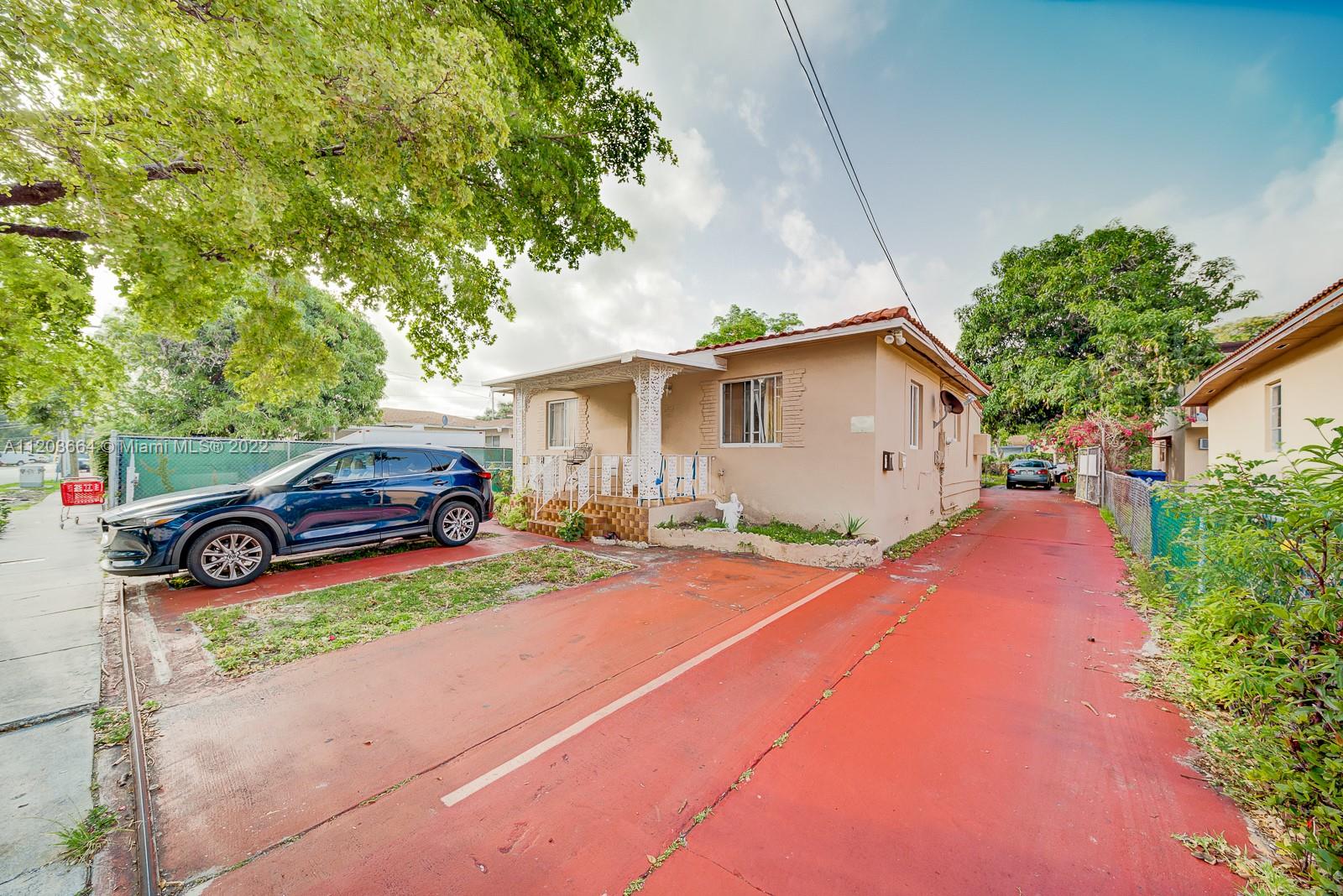 a house view with a backyard space