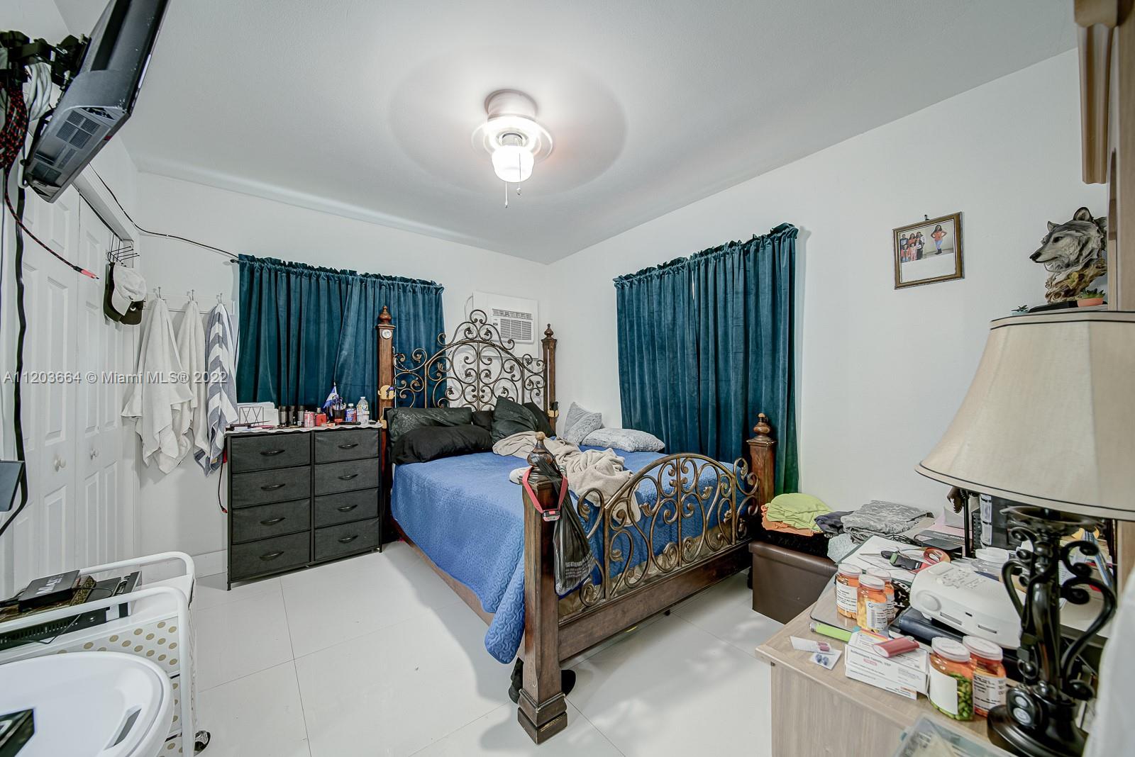 1920 Southwest 4th Street Miami, FL 33135 - Photo 13 of 28 a bed room with a bed and a window