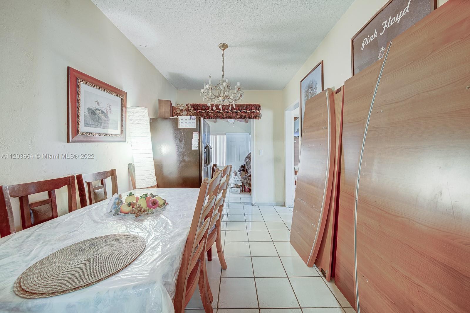 1920 Southwest 4th Street Miami, FL 33135 - Photo 20 of 28 a dining room with furniture and window
