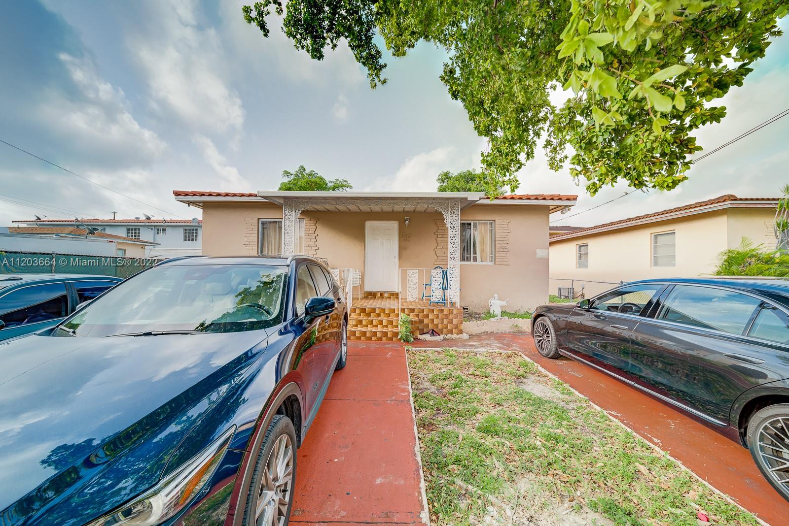 1920 Southwest 4th Street Miami, FL 33135 - Photo 2 of 28 a view of a backyard with a patio