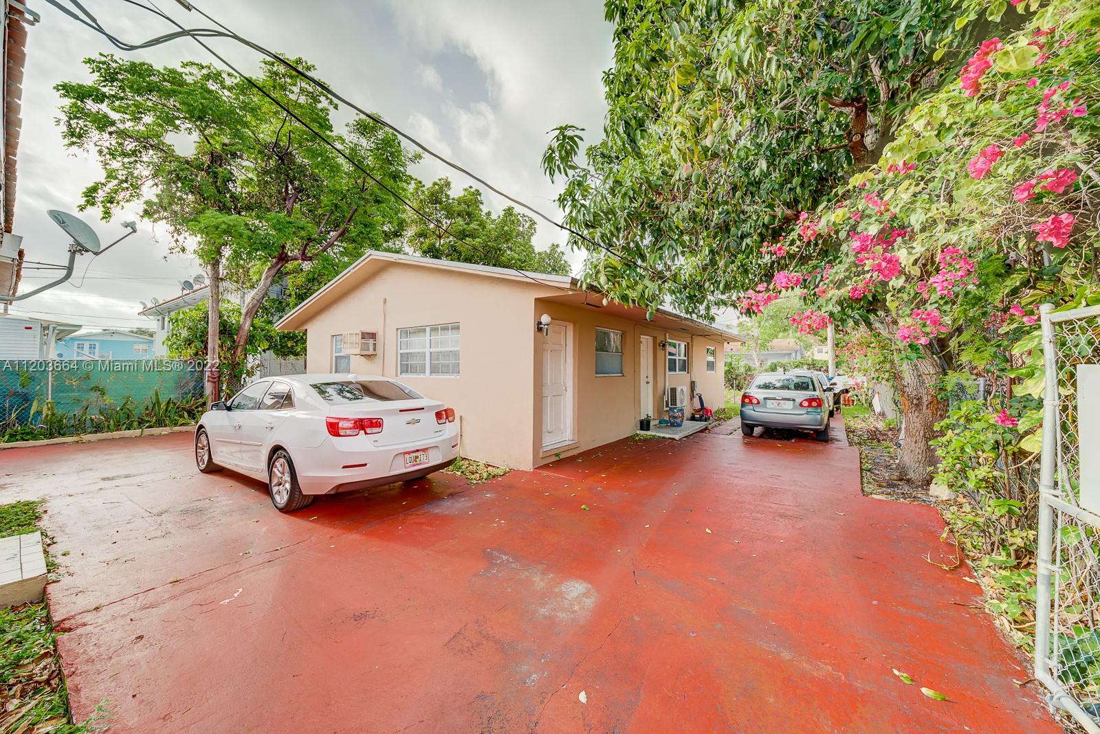 1920 Southwest 4th Street Miami, FL 33135 - Photo 22 of 28 a white car parked in front of white house