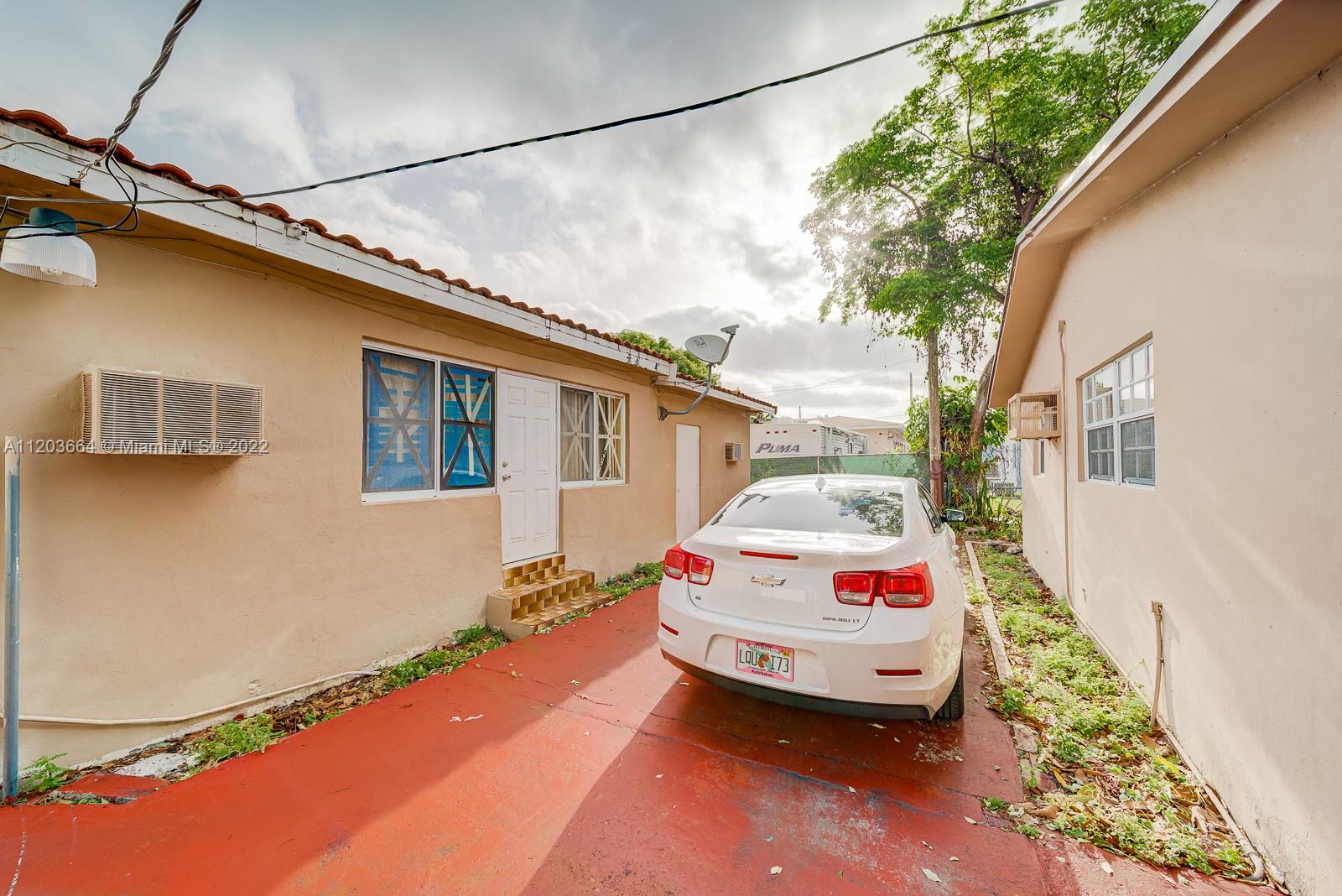 1920 Southwest 4th Street Miami, FL 33135 - Photo 23 of 28 a car parked in front of a house