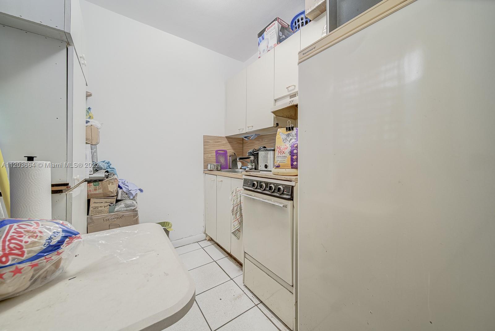 1920 Southwest 4th Street Miami, FL 33135 - Photo 3 of 28 a bedroom with a bed and a cabinets