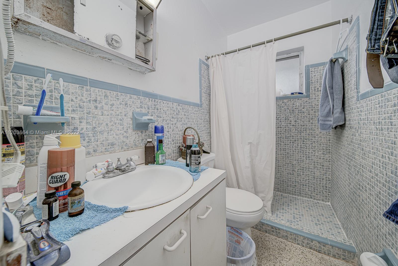 1920 Southwest 4th Street Miami, FL 33135 - Photo 5 of 28 a bathroom with a sink toilet and shower