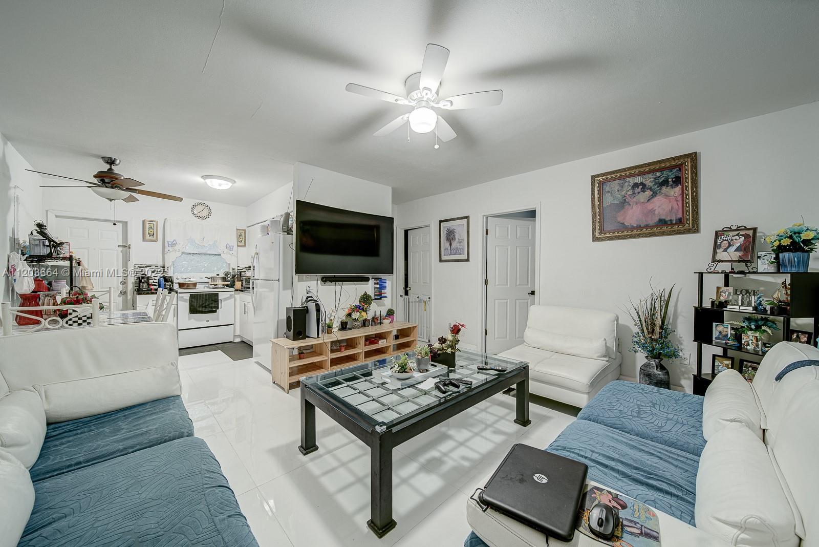 1920 Southwest 4th Street Miami, FL 33135 - Photo 8 of 28 a living room with furniture and a flat screen tv