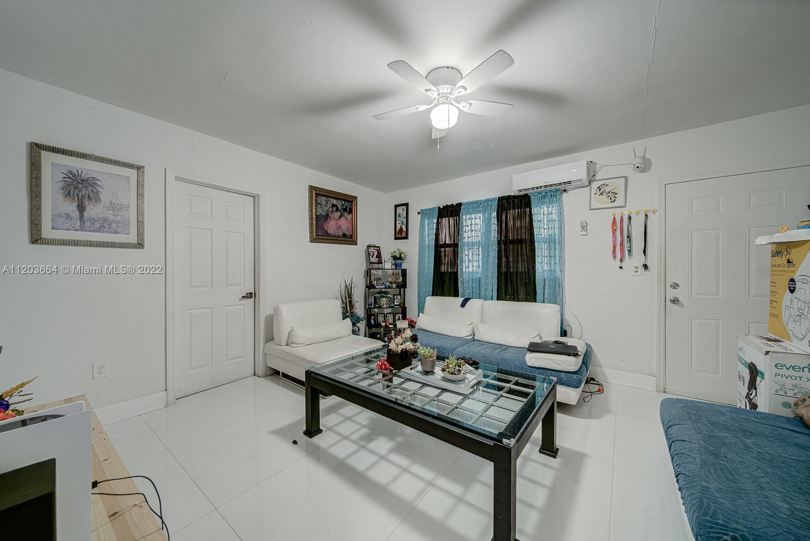 1920 Southwest 4th Street Miami, FL 33135 - Photo 9 of 28 a living room with furniture and a table