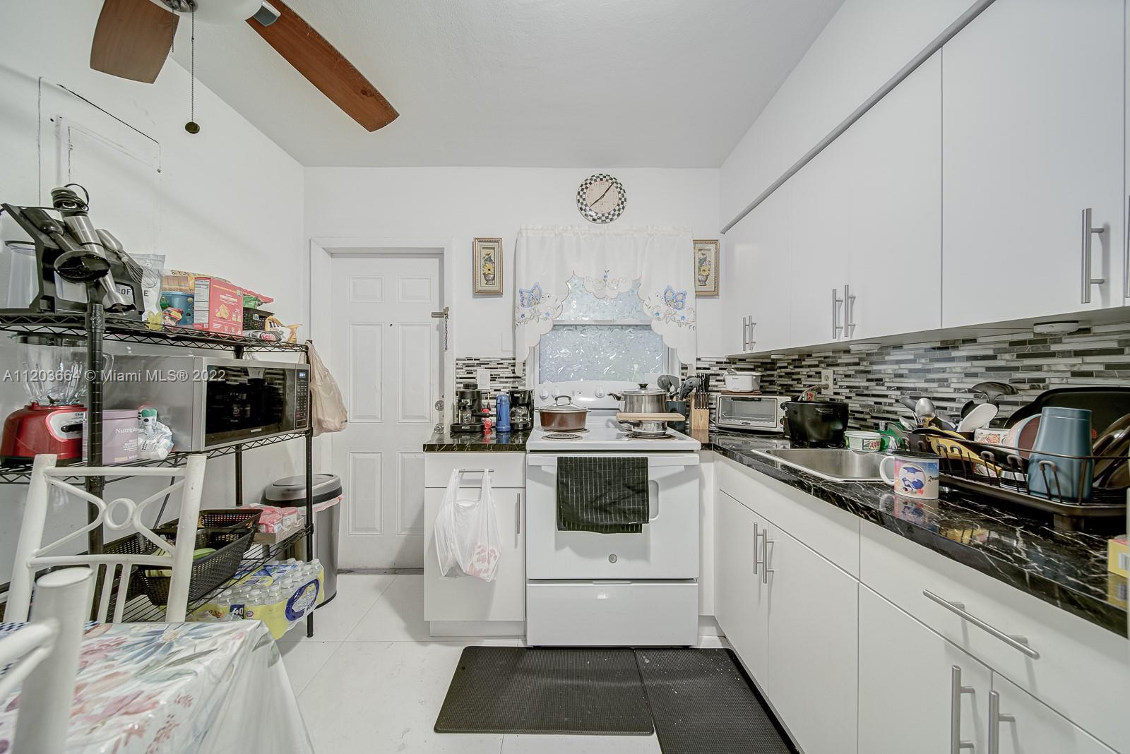 1920 Southwest 4th Street Miami, FL 33135 - Photo 10 of 28 a kitchen with sink cabinets and appliances