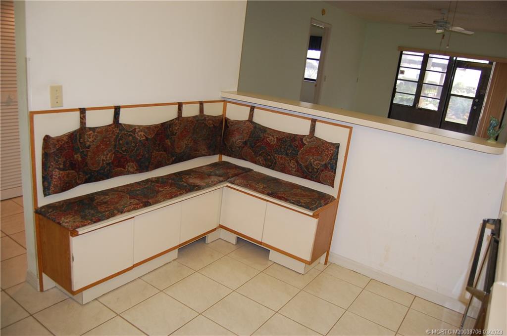 1881 Southwest Palm City Road, Unit H201 Stuart, FL 34994 - Photo 14 of 33 Banquette kitchen seating. Just add a table!