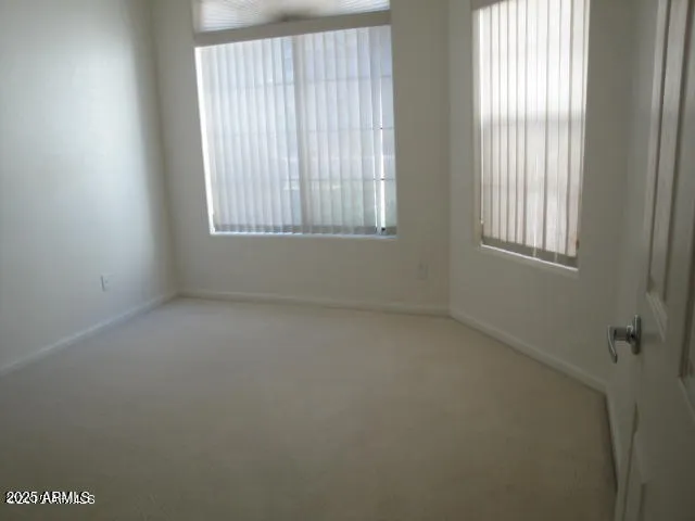 a bathroom with a double vanity sink a mirror and a shower